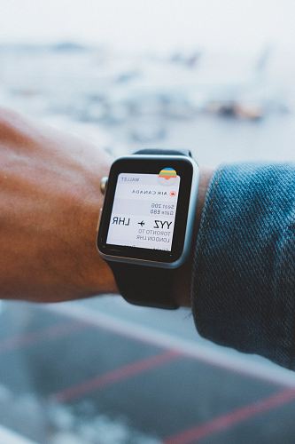 space gray aluminum case Apple Watch and black leather band turned on